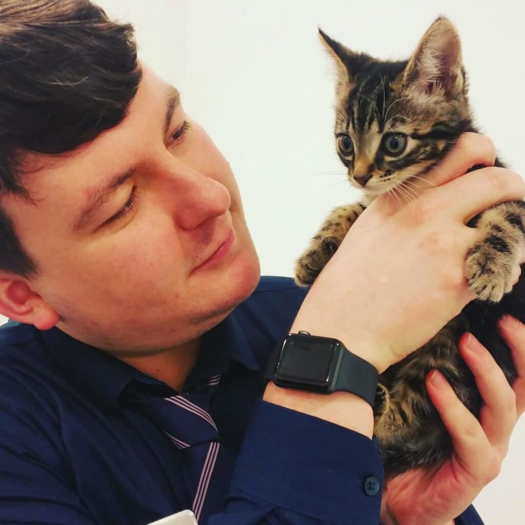 man holding a kitten 
