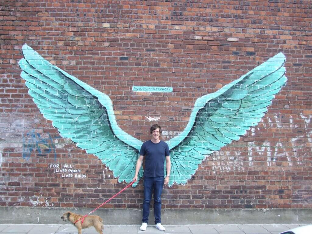 man with dog with wings